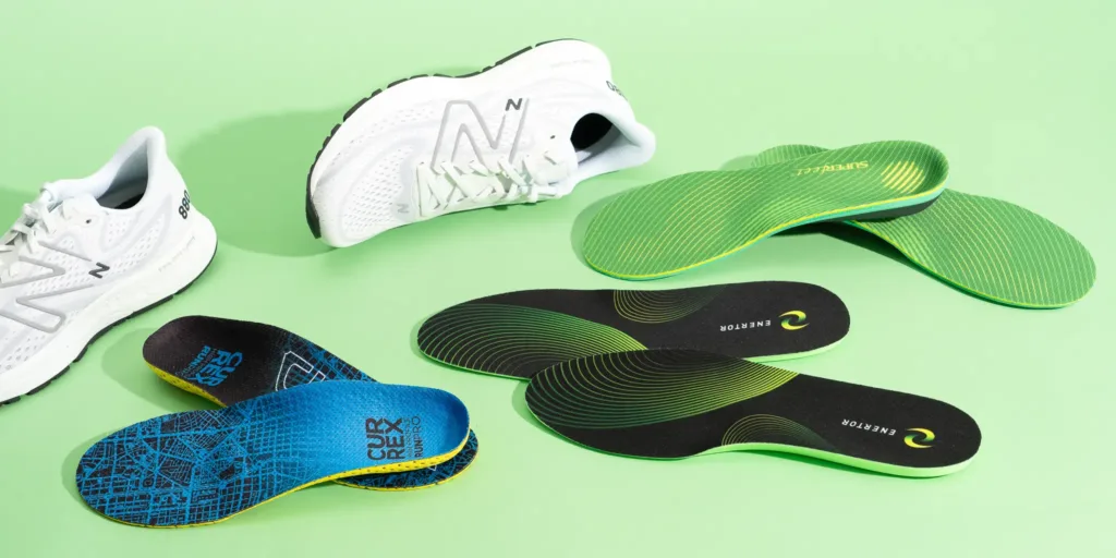 three different insoles on green floor with new brand wife shoes